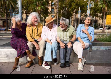 Senior friends enjoying city holiday laughing together Stock Photo