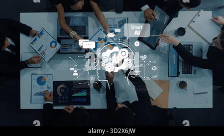 A diverse team collaborates in a meeting environment, utilizing technology and data to drive strategic AI innovation. Ideas flow as discussions on bus Stock Photo