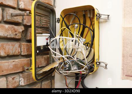 A switchboard with an electrical connecting cables and wi-fi router box Stock Photo