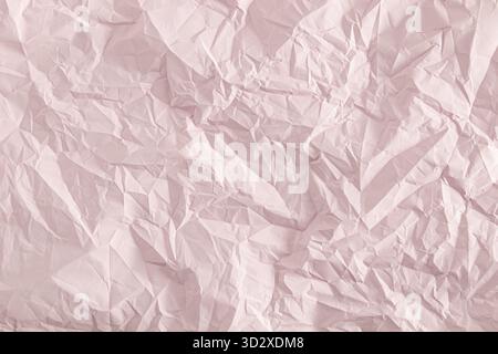 Delicate pink background of crumpled paper. paper abstract background. template, layout, product presentation Stock Photo