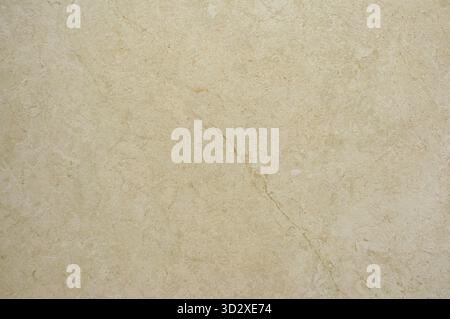 Texture of natural stone in yellow color. Interior finishing material, beige bathroom wall tiles Stock Photo