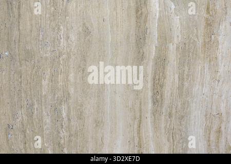 Texture of natural stone travertine of beige color, layered texture. Finishing material for interior, wall tiles Stock Photo