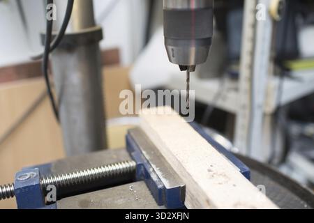 Drilling machine with laser sight in the workshop Stock Photo