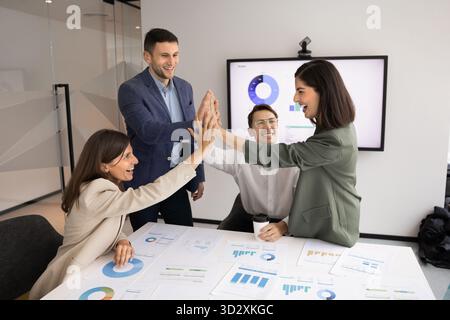 Group of happy young business project managers celebrating success Stock Photo
