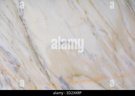 Golden veined marble texture with soft white and gray hues for interior use Stock Photo