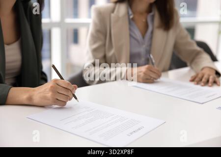 Two businesswomen getting agreement after negotiation meeting Stock Photo