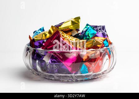 London, United Kingdom, October 22st 2025 :- A view of a selection of Cadbury's Roses on a white background Stock Photo