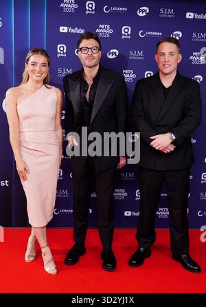(left to right) Sian Welby, Jordan North and Chris Stark attending the Music Industry Trusts Award, at the Grosvenor House in London. Picture date: Monday November 3, 2025. Stock Photo