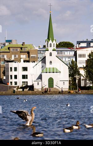 Frikirkjan church by Tjornin lake, Reykjavik Iceland.  It was built in 1901, in the Gothic style. Stock Photo