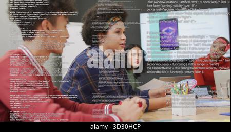 Curly-haired developer leading discussion in conference room with laptops smartphone documents code Stock Photo