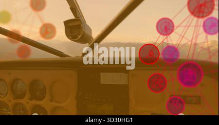 Displaying cockpit instrument panel featuring gauges over snowy mountains, with network overlay Stock Photo