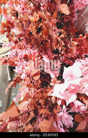Artificial flowers with many petals and decorations background Stock Photo