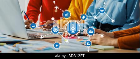 A diverse team collaborates around a laptop, utilizing data visualization graphics to enhance business strategy and innovation in a modern workspace s Stock Photo