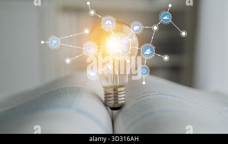 A striking image of a light bulb representing innovation is set on an open book, showcasing the fusion of technology and knowledge with various connec Stock Photo