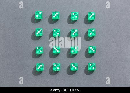 Green game dices on grey background Stock Photo