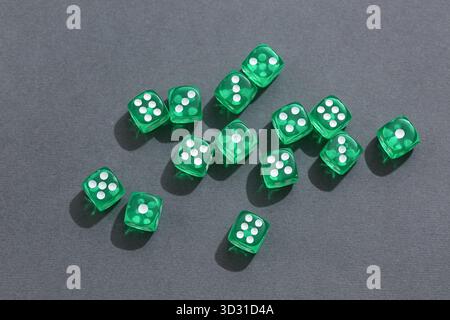 Green game dices on grey background Stock Photo