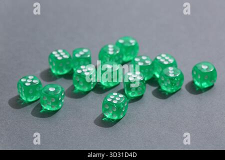 Green game dices on grey background Stock Photo