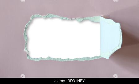 Horizontal rectangular hole or tear sheet of muted pink or dusty rose cardboard paper, exposing blank white space center and shadow. Hole has rough ja Stock Photo