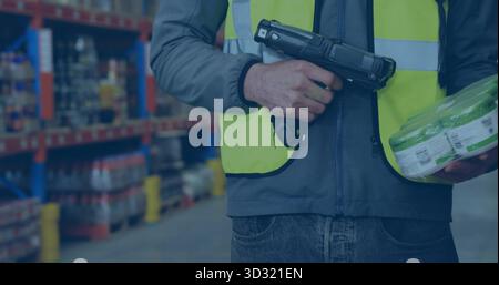 Scanning worker wearing vest using barcode scanner holding shrinkwrapped pack in aisle, copy space Stock Photo