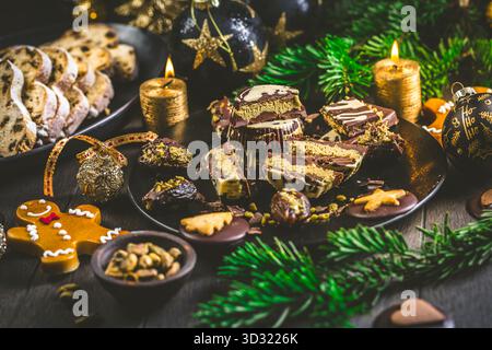 Dubai chocolate pralines with pistachio cream and Christmas cookies Stock Photo