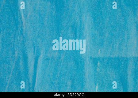 Old blank blue ripped torn grunge posters backgrounds creased crumpled paper backdrop surface placard empty space for text Stock Photo