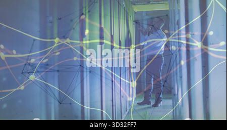 Inspecting admin adjusting server connections in data center corridor, with LED lights, copy space Stock Photo
