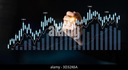 A person hand interacts with financial graphs on a dark background, illustrating an upward trend and showcasing data analysis for business strategies. Stock Photo