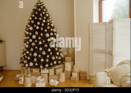 Beautifully decorated Christmas tree with many presents under it. Stock Photo