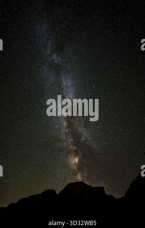 Milky Way in the starry sky above Lago di Braies in South Tyrol, Italy. Stock Photo