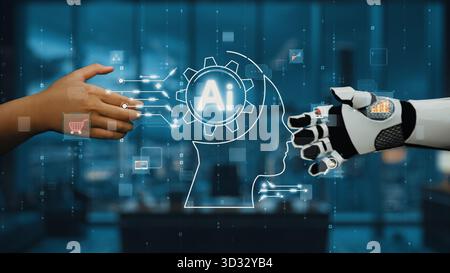 This image showcases the interaction between a human hand and a robotic hand, symbolizing the collaboration between artificial intelligence and human Stock Photo