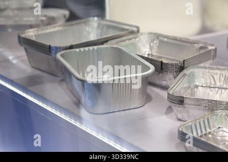 Food aluminum containers in the showroom. Industry Stock Photo