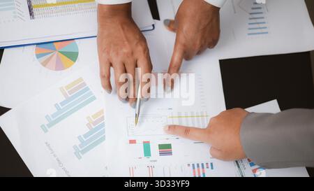 Business team analyzing financial charts and data reports during meeting. Concept of strategy planning, finance management, and business analytics for Stock Photo