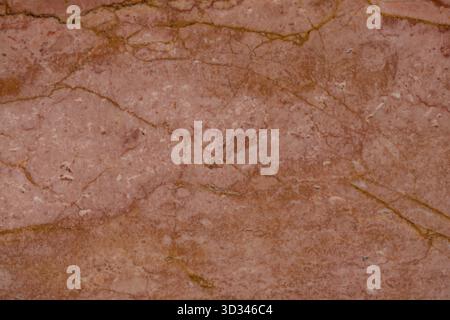 Texture of red marble slab with organic patterns and veins, ideal for interior applications Stock Photo