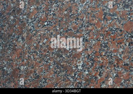 Texture of red spotted granite, natural polished stone, noisy texture Ukrainian granite Stock Photo
