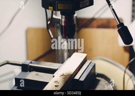 Drilling machine with laser sight in the workshop Stock Photo