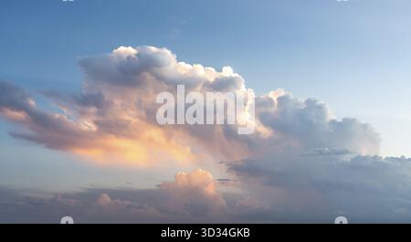 Blue sunset sky with many nice white clouds Stock Photo