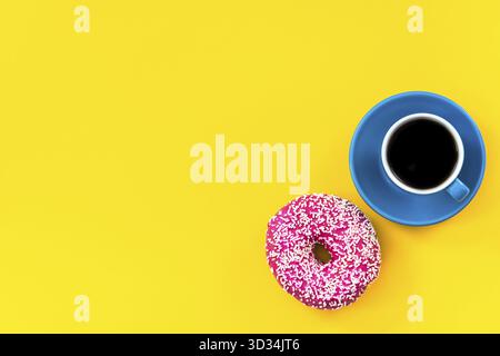Coffee and donut on bright background, top view, flat lay Stock Photo