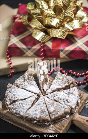 Christmas festive fruit rich cake sliced in portions Stock Photo