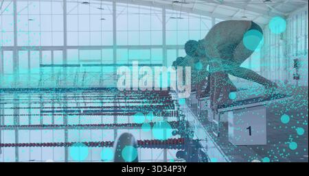 Poising swimmer leaning forward on starting block at swim center, with digital overlays, copy space Stock Photo