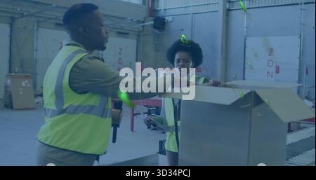 Workers adjusting shipping box and scanning labels on conveyor belt in sorting area with scanners Stock Photo