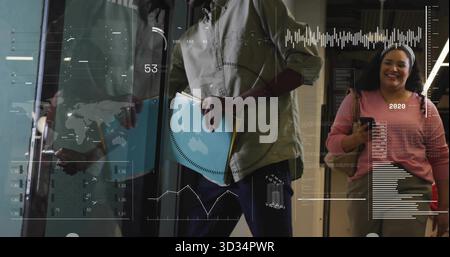 Opening office lobby glass door wearing shirt and jeans, holding blue folder with digital overlay Stock Photo