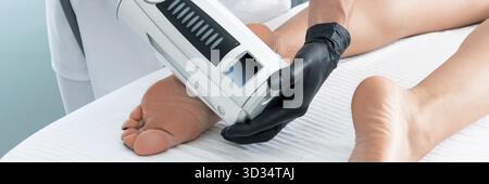 Partial view of cosmetologist in rubber gloves doing endospheres therapy Stock Photo