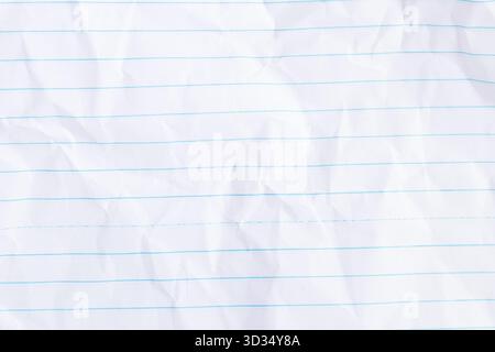 Top view and full frame of wrinkled or crumpled lined or ruled paper texture used as crumpled white paper background texture in decorative art work Stock Photo