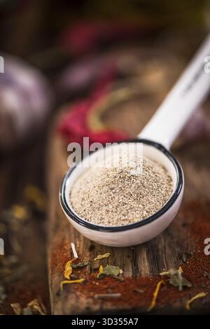 White pepper powder on spoon Stock Photo