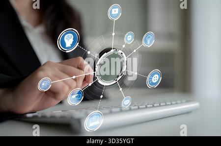 A professional woman interacts with a keyboard, surrounded by digital icons illustrating technology, innovation, and data analysis in a modern office Stock Photo