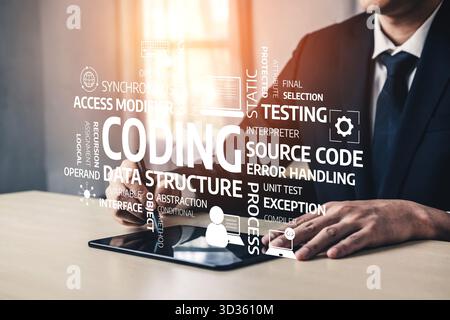 Professional individual in formal attire engaging with a tablet, surrounded by visual elements related to coding, data management, and software Stock Photo