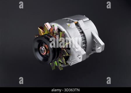 car generator close-up, element of the car power supply system, on a black background, close-up, selective focus Stock Photo