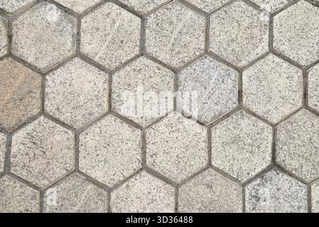 stone background made of hexagonal slabs, background in the form of honeycombs. Stock Photo