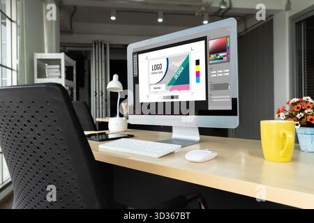 Graphic designer software for modern design of web page and commercial ads showing on the computer screen Stock Photo