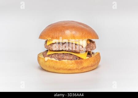 Beef burger with Parmesan cheese, arugula, and truffle oil on Italian bread Stock Photo